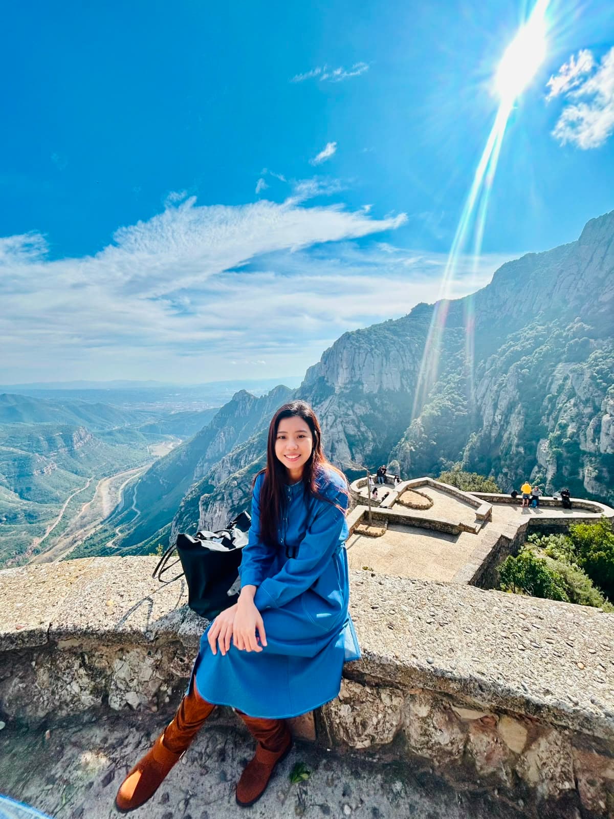 Jaira David sitting on a mountain overlook
